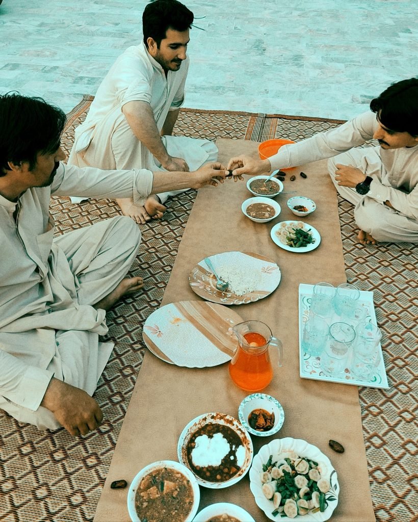 men-sharing-a-meal-together-outdoors-2026-01-07-06-27-44-utc